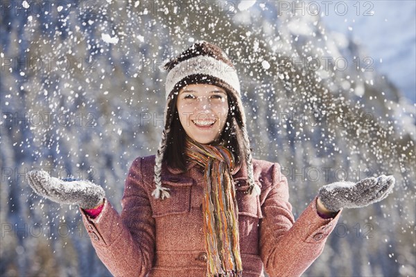 Caucasian woman standing in snowfall