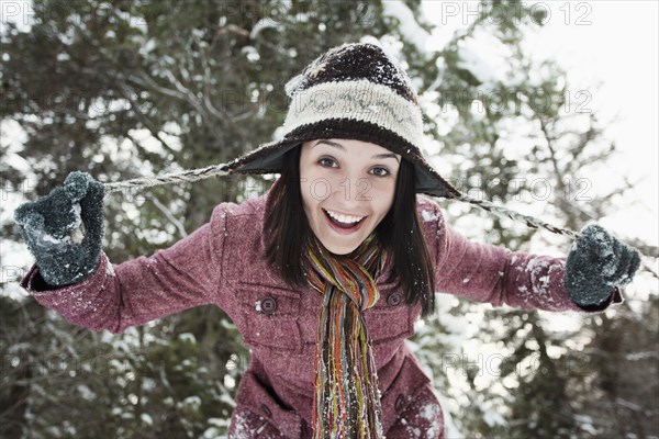 Caucasian woman playing in the snow