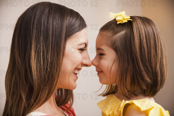 Caucasian mother smiling at daughter