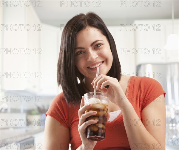 Caucasian woman drinking soda