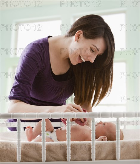 Caucasian mother looking at baby girl