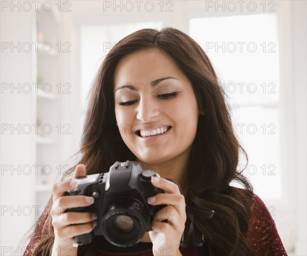 Mixed race woman looking at camera