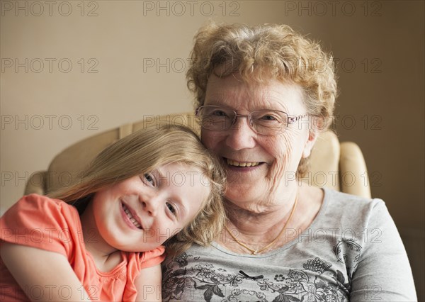 Smiling Caucasian grandmother and granddaughter