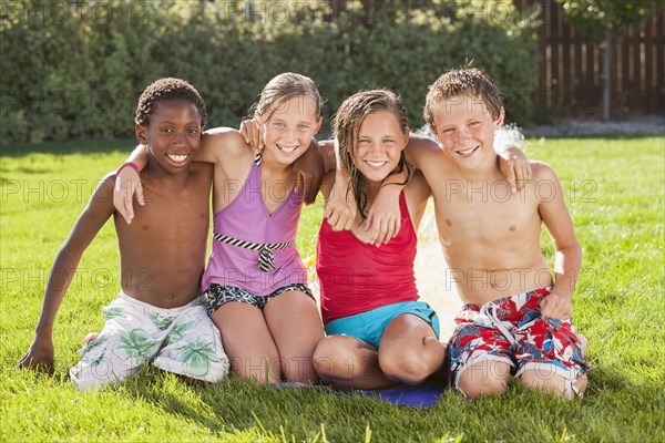 Friends hanging out together in yard