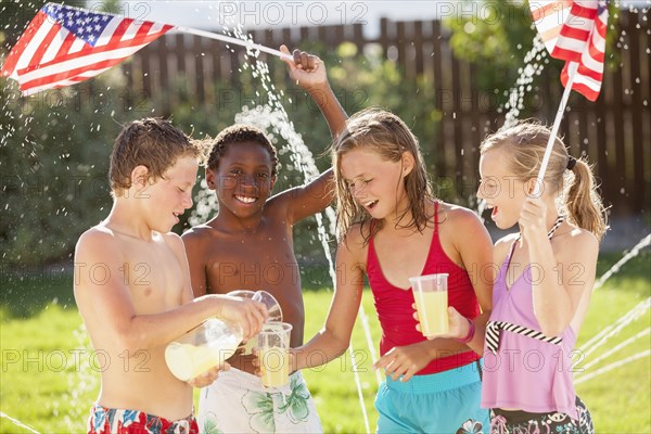 Caucasian friends drinking lemonade on Fourth of July