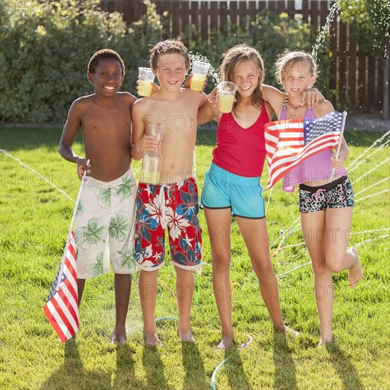 Caucasian friends drinking lemonade on Fourth of July