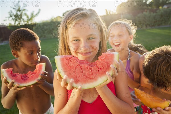 Children eating watermelon