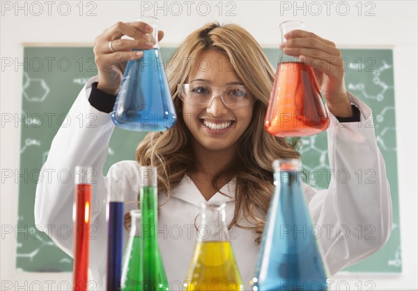 Mixed race student working in chemistry lab