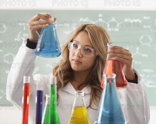 Mixed race student working in chemistry lab