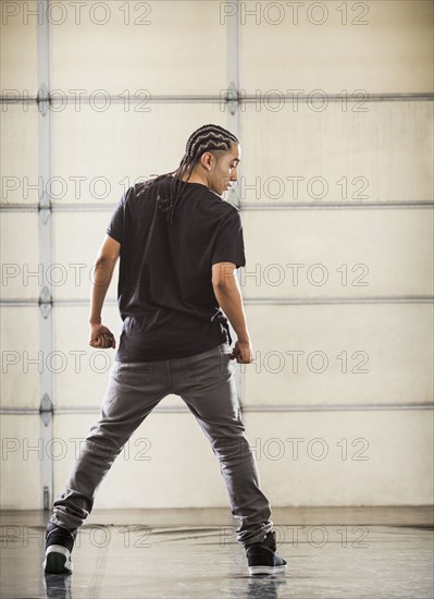 Hispanic dancer practicing in studio