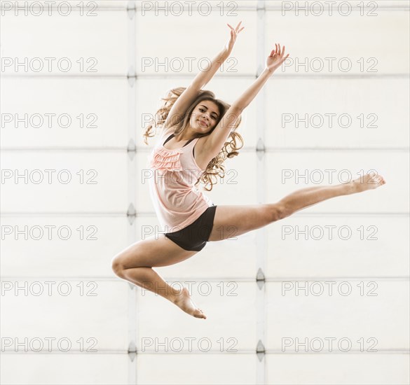 Hispanic dancer practicing in studio