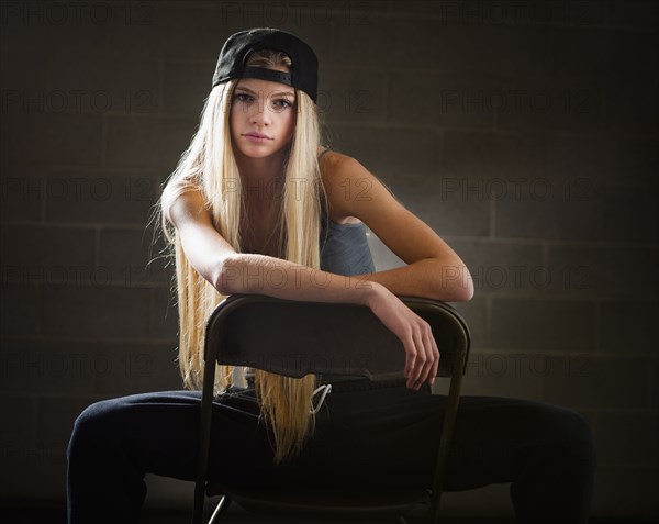 Caucasian woman sitting in folding chair