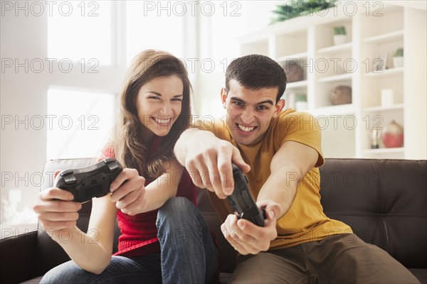 Couple playing video games together