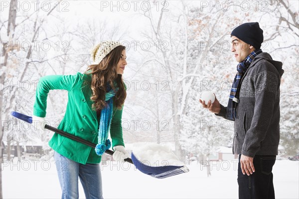 Couple playing in snow