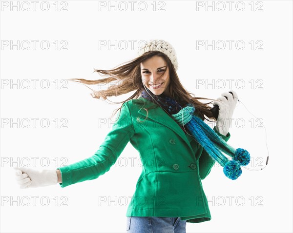 Caucasian woman listening to earphones