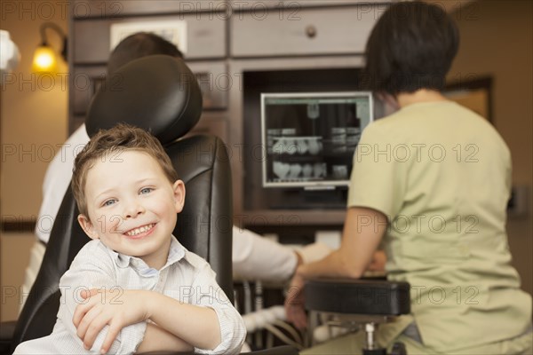 Boy smiling in dentist's office