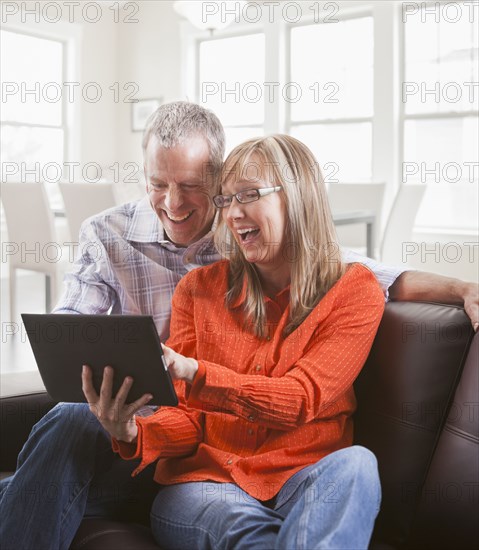 Caucasian couple using tablet computer
