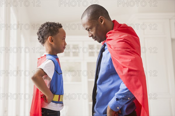 Father and son playing superhero