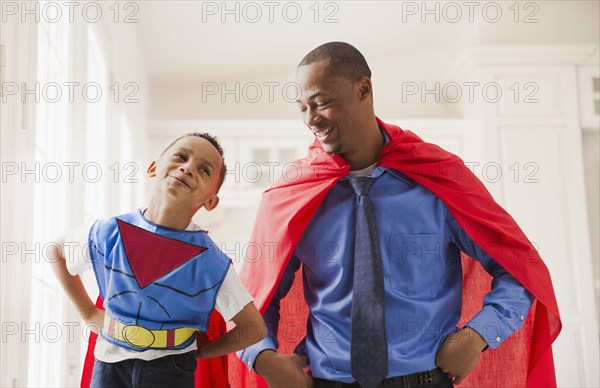 Father and son playing superhero