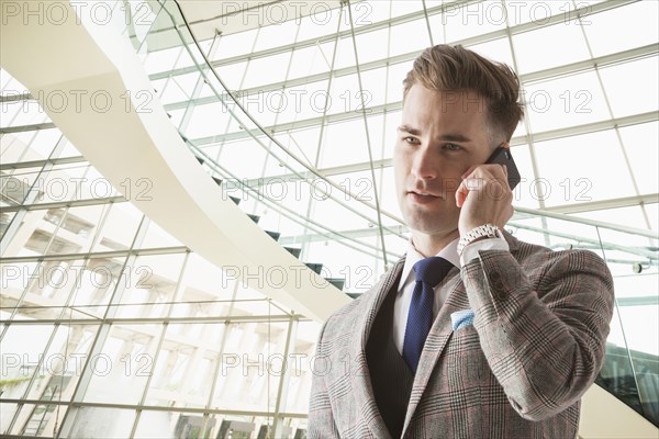 Caucasian businessman talking on cell phone