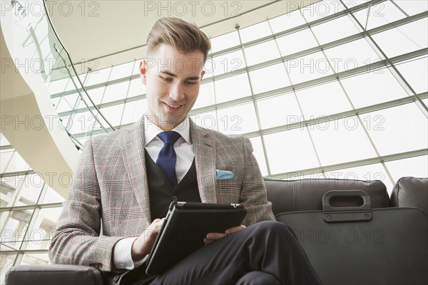 Caucasian businessman using digital tablet