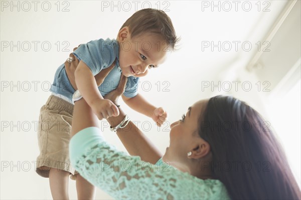 Mother playing with baby boy