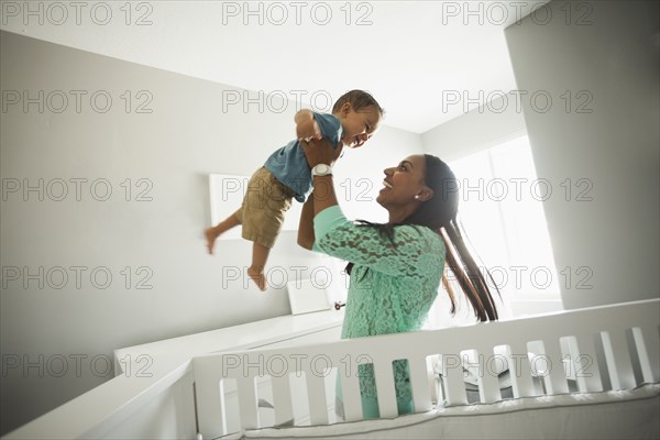 Mother playing with baby boy