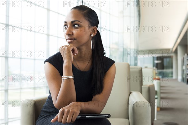 Indian businesswoman sitting in lobby area