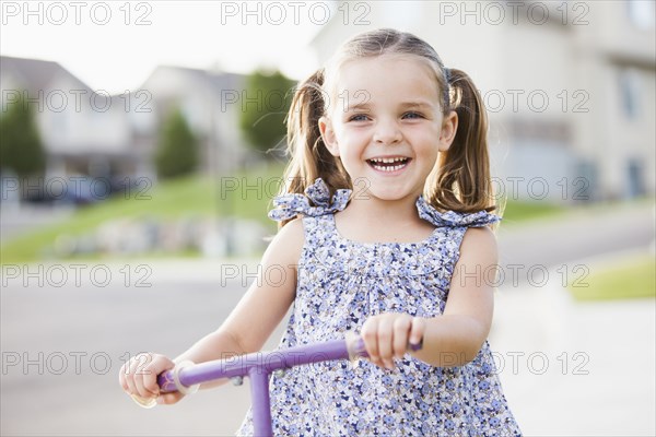 Caucasian girl playing outdoors