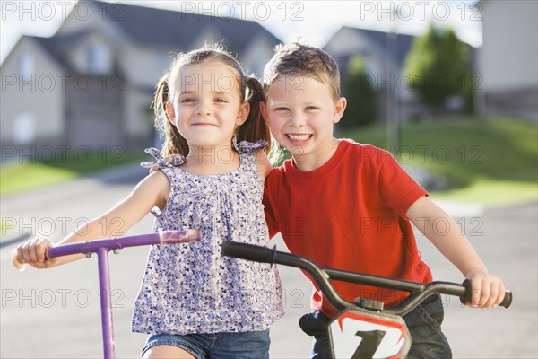 Caucasian children smiling outdoors