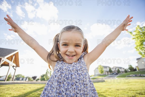 Caucasian girl playing outdoors