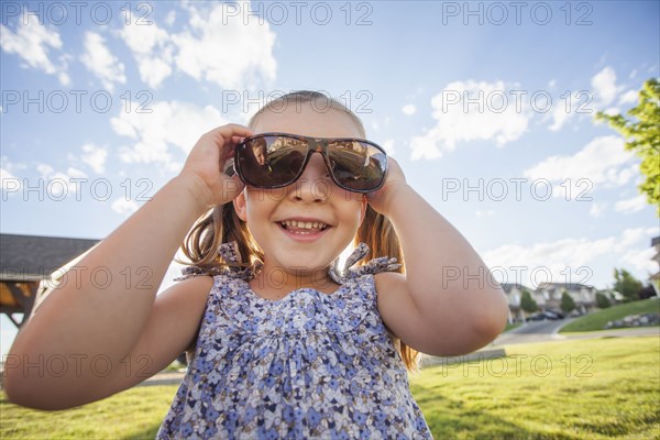 Caucasian girl wearing sunglasses outdoors