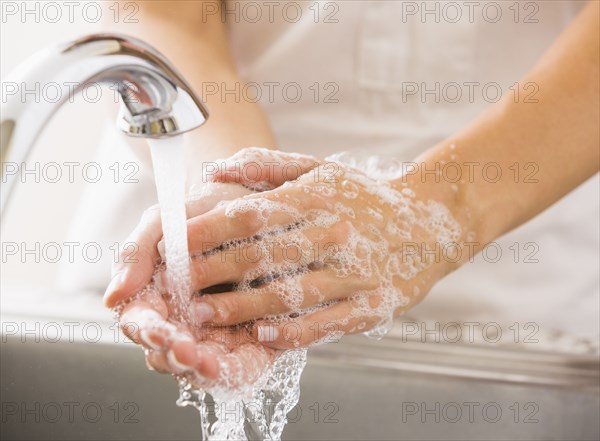 Caucasian woman washing her hands