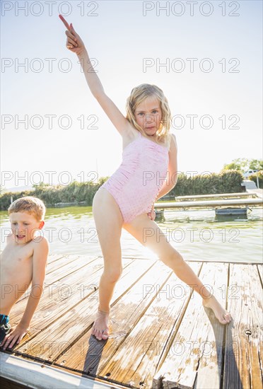 Caucasian girl posing on dock