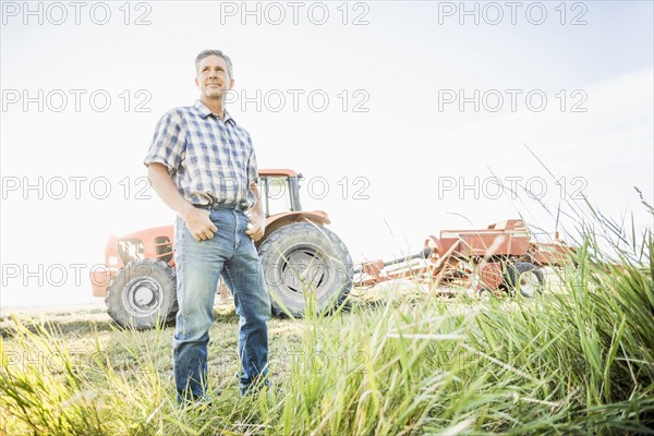 Caucasian farmer standing in field