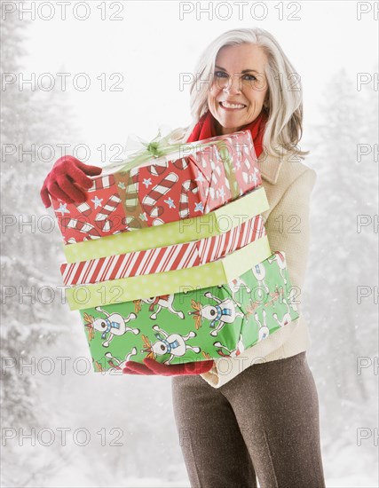 Portrait of Caucasian woman with Christmas gifts