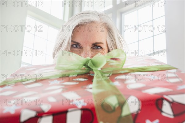 Close up portrait of Caucasian woman with Christmas gift