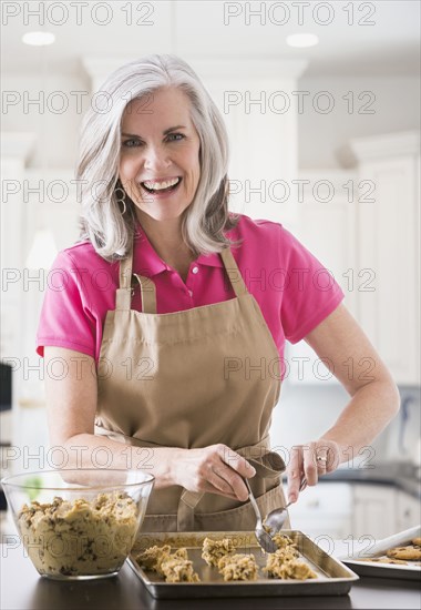 Portrait of Caucasian woman baking cookies