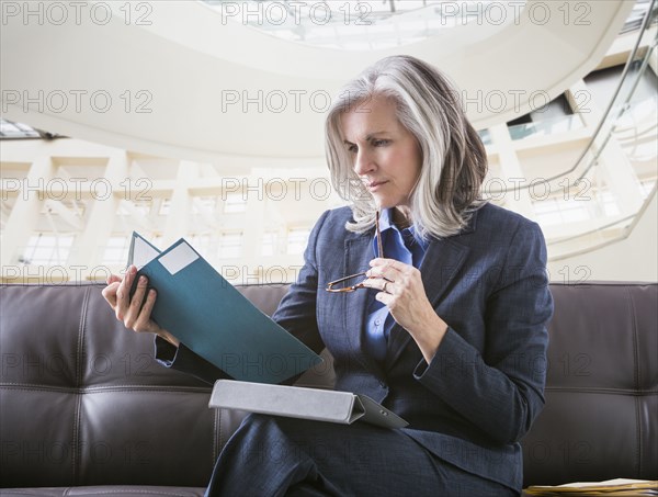 Caucasian businesswoman using digital tablet