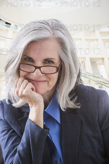 Close up portrait of smiling Caucasian businesswoman