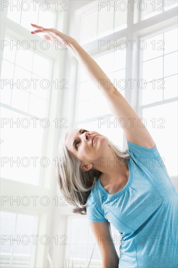 Caucasian woman practicing yoga