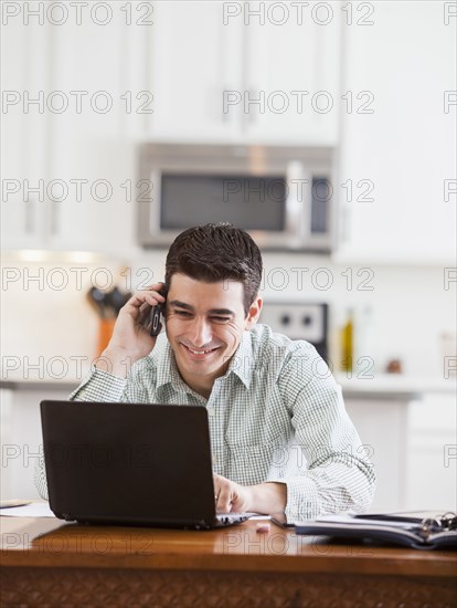 Hispanic businessman working at home