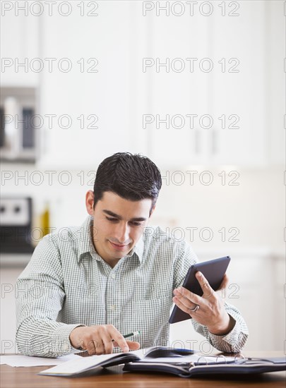 Hispanic businessman working at home