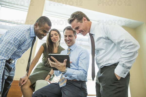 Business people using digital tablet in office