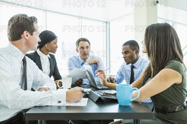 Business people talking in meeting