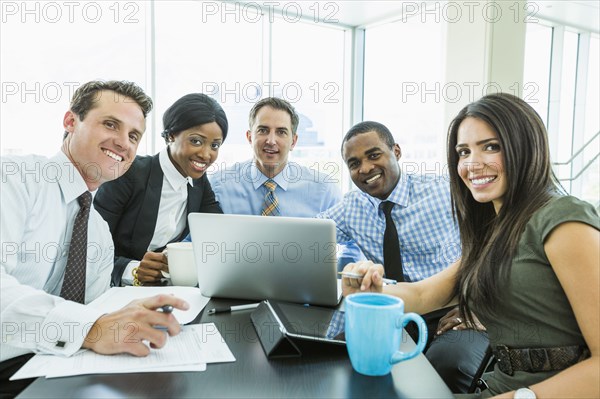 Business people smiling in meeting