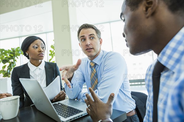 Business people talking in meeting