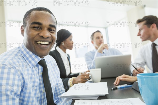 Businessman smiling in meeting