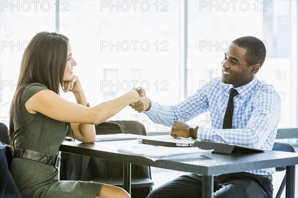 Business people shaking hands in meeting