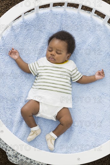 Sleeping baby laying in crib